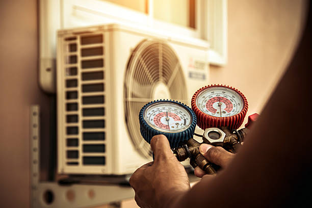 Professional Air Conditioning Service technician working in Saint Albans, MO